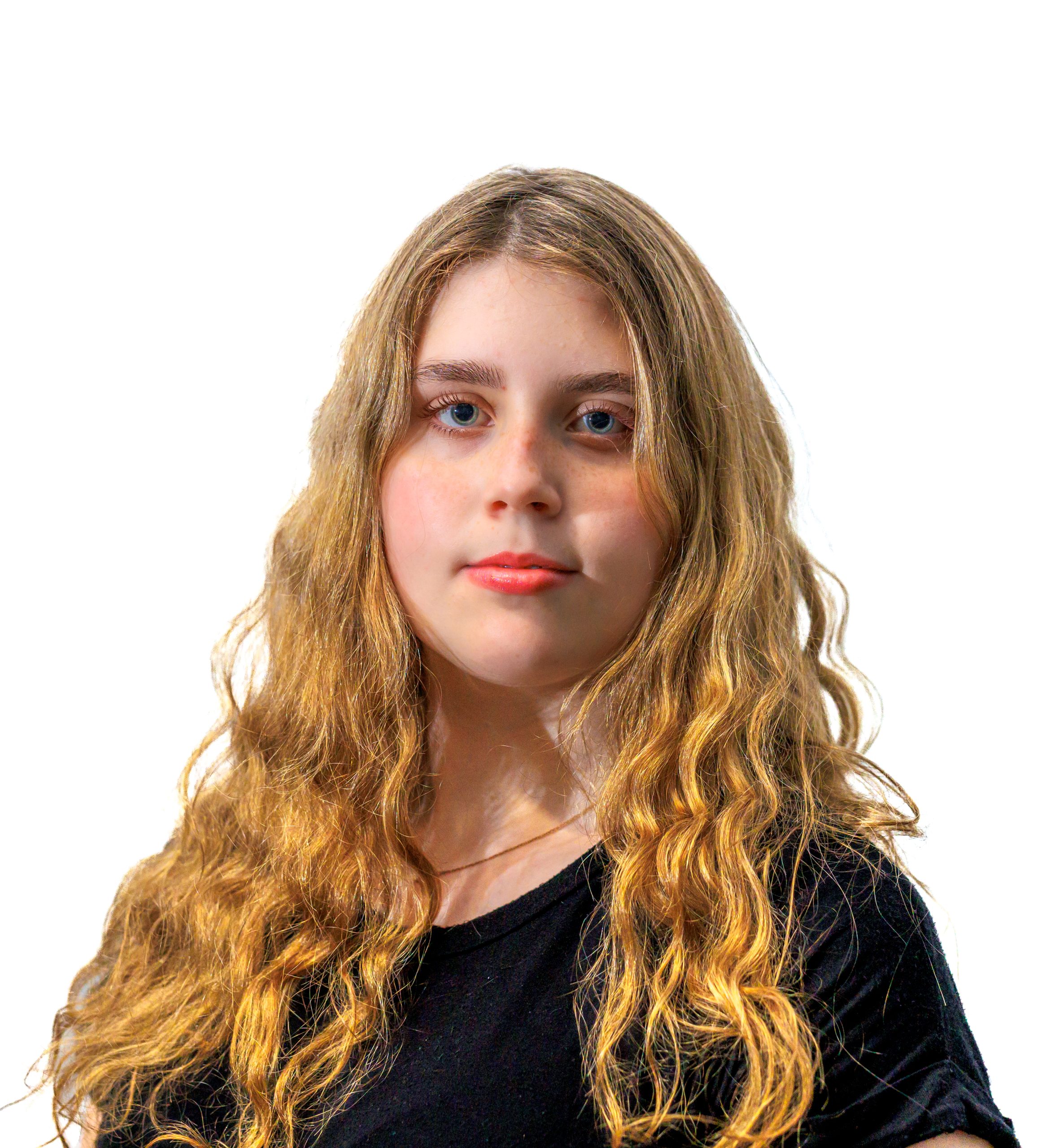 Headshot of Brooke Campbell facing forward but shoulders facing away.